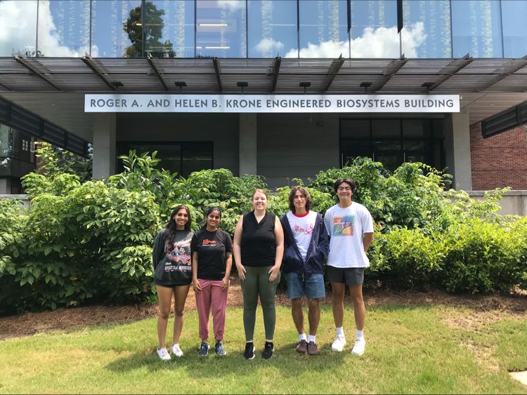  Michael Ortega, Jameson Pham, Parul Methi, Harini Mudradi, and Bri in front of the biosci building